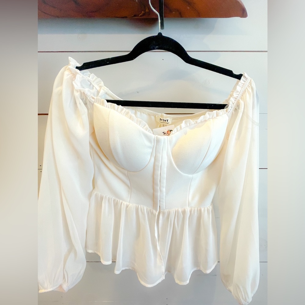 Flirty crop top with romantic sweetheart neckline, sheer detail